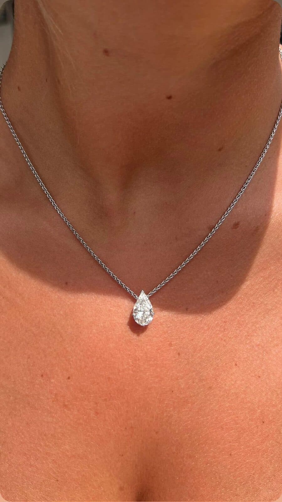 A pendant on a fine chain.